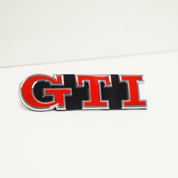 NEW VOLKSWAGEN GOLF MK7 POLO GTI EMBLEM SIGN LOGO GRILLE 5G0853679AGKRR ORIGINAL - Image 2